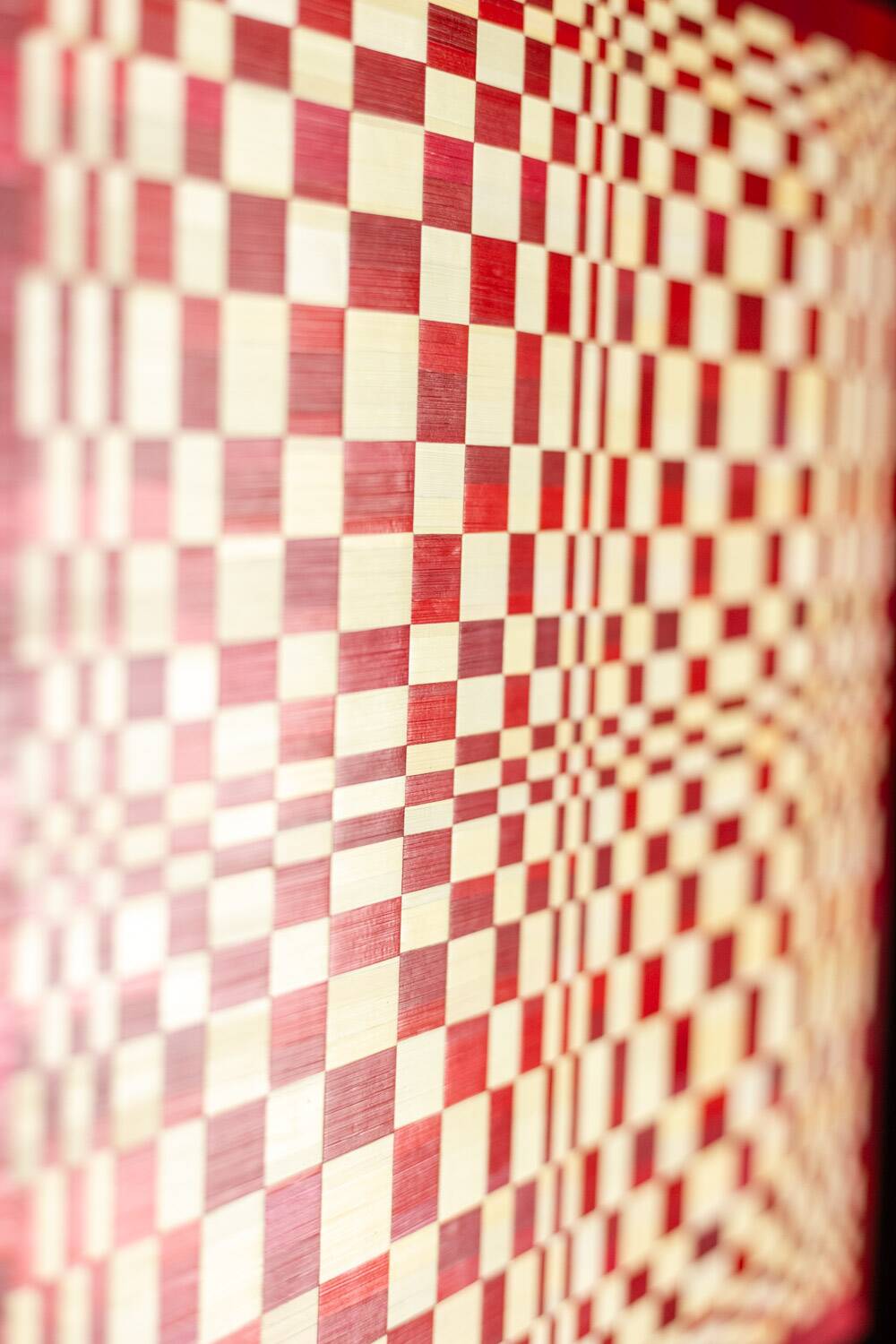 Pair of panels in red and gold straw marquetry. Contemporary.