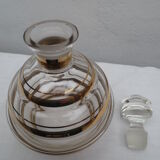 Carafe ancienne corps ondulé en verre décor filets or