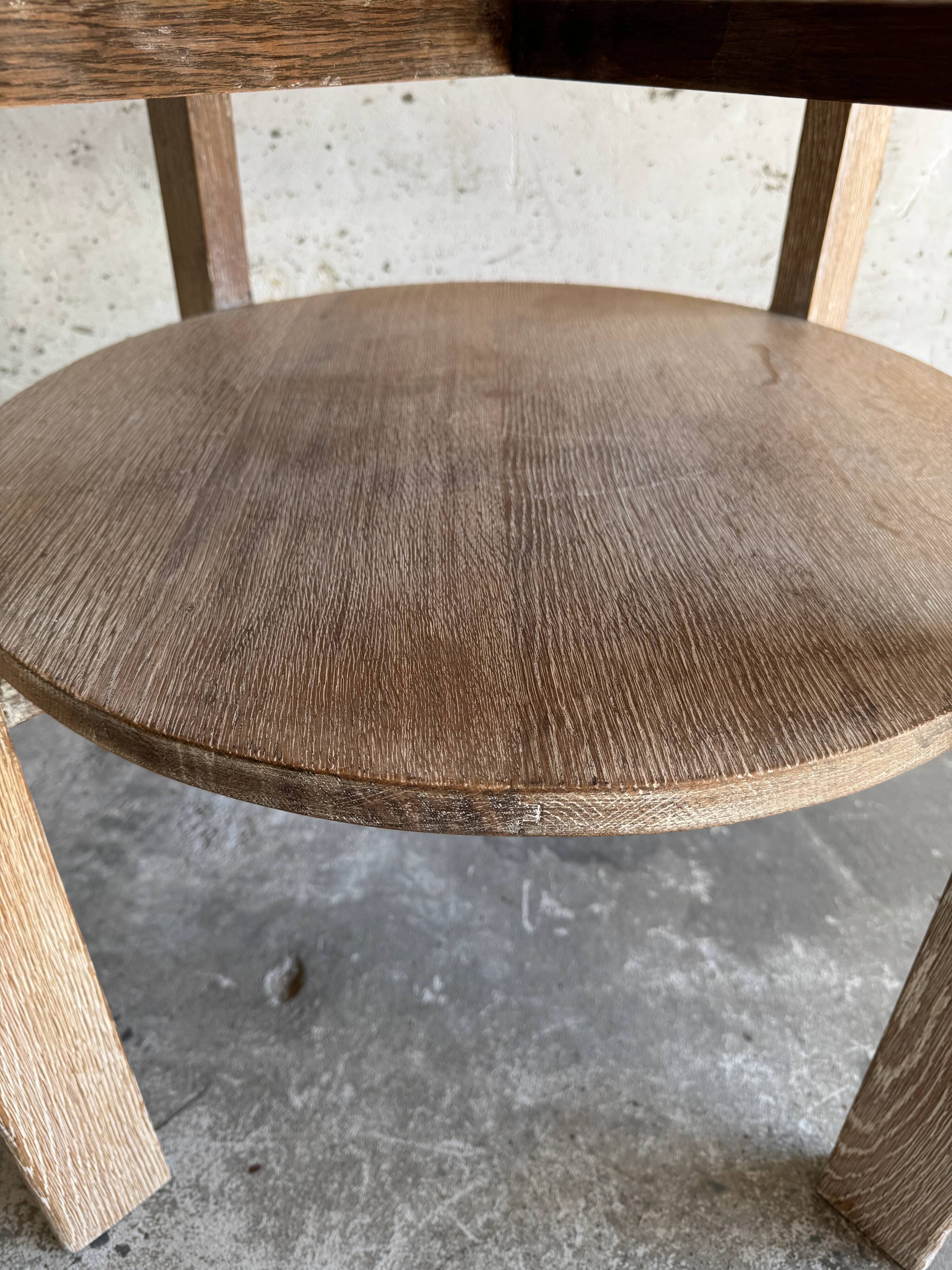 Art Deco round oak side table in light weathered oak with lower shelf, geometric three-leg design