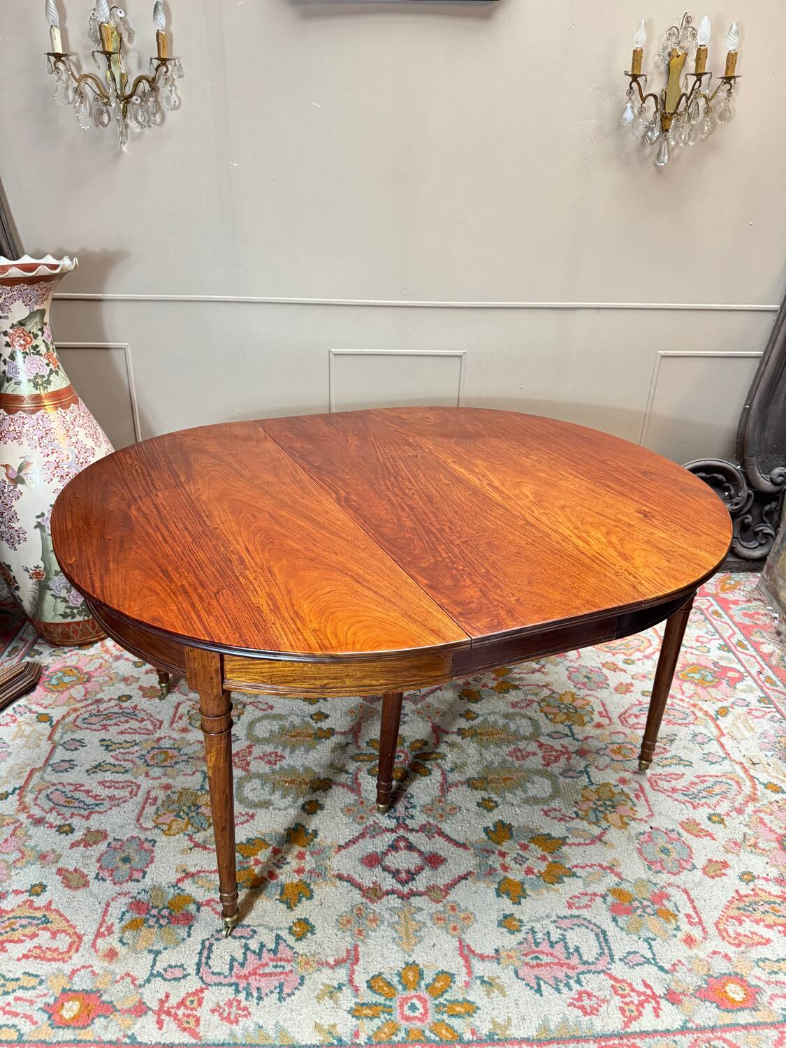 Dining table with a mahogany band in louis xvi style