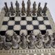 Vintage chess set in patinated metal alloy with a 39 cm chessboard from the 1980s.