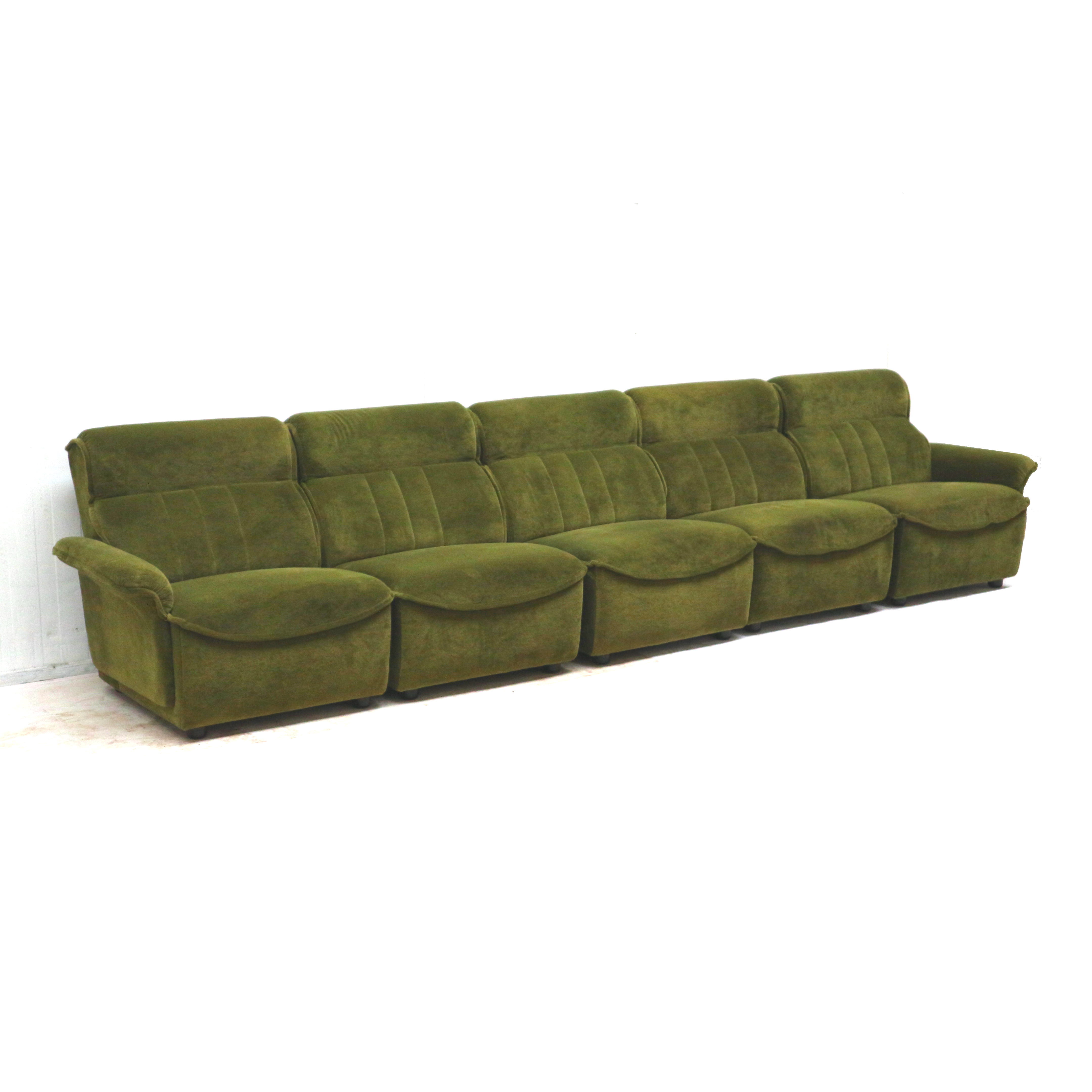 Green velvet vintage element sofa made in the 1970s