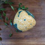 Ceramic ball vase with yellow and green leaf patterns