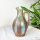 Art Nouveau style carafe in flamed stoneware with blue and brown drips