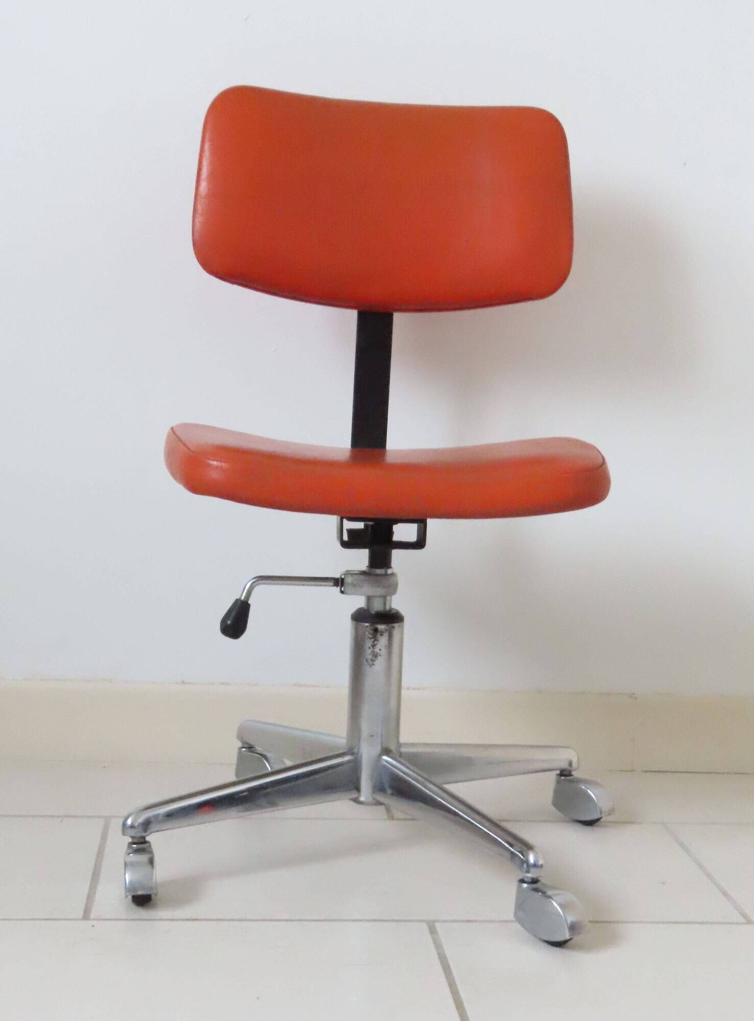 Eurosit vintage industrial workshop chair in chromed metal and orange imitation leather