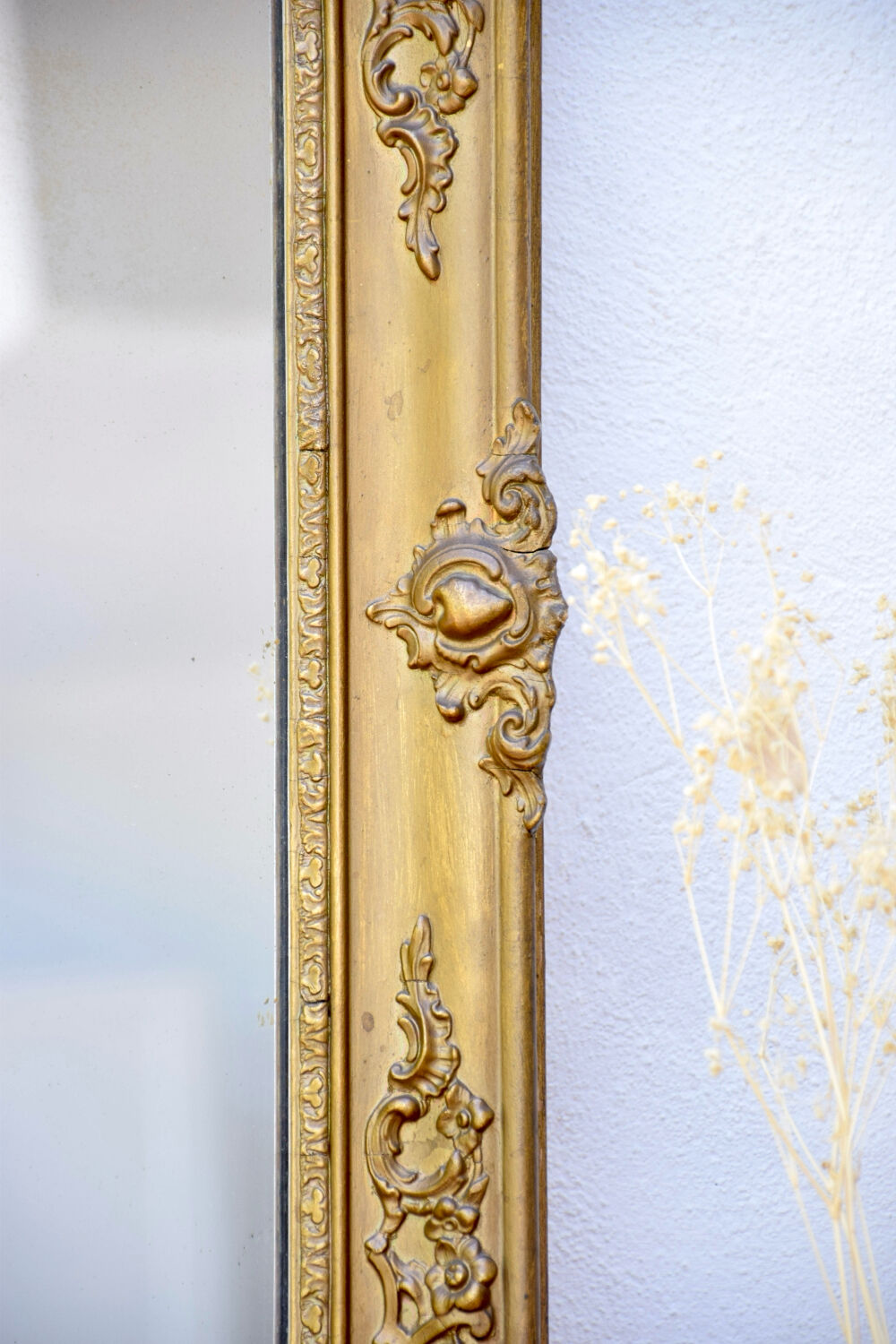 Antique mirror with gilded moldings