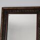 Antique mirror with a carved and painted wooden frame