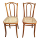 Pair of vintage bistro chairs in curved wood and caning.