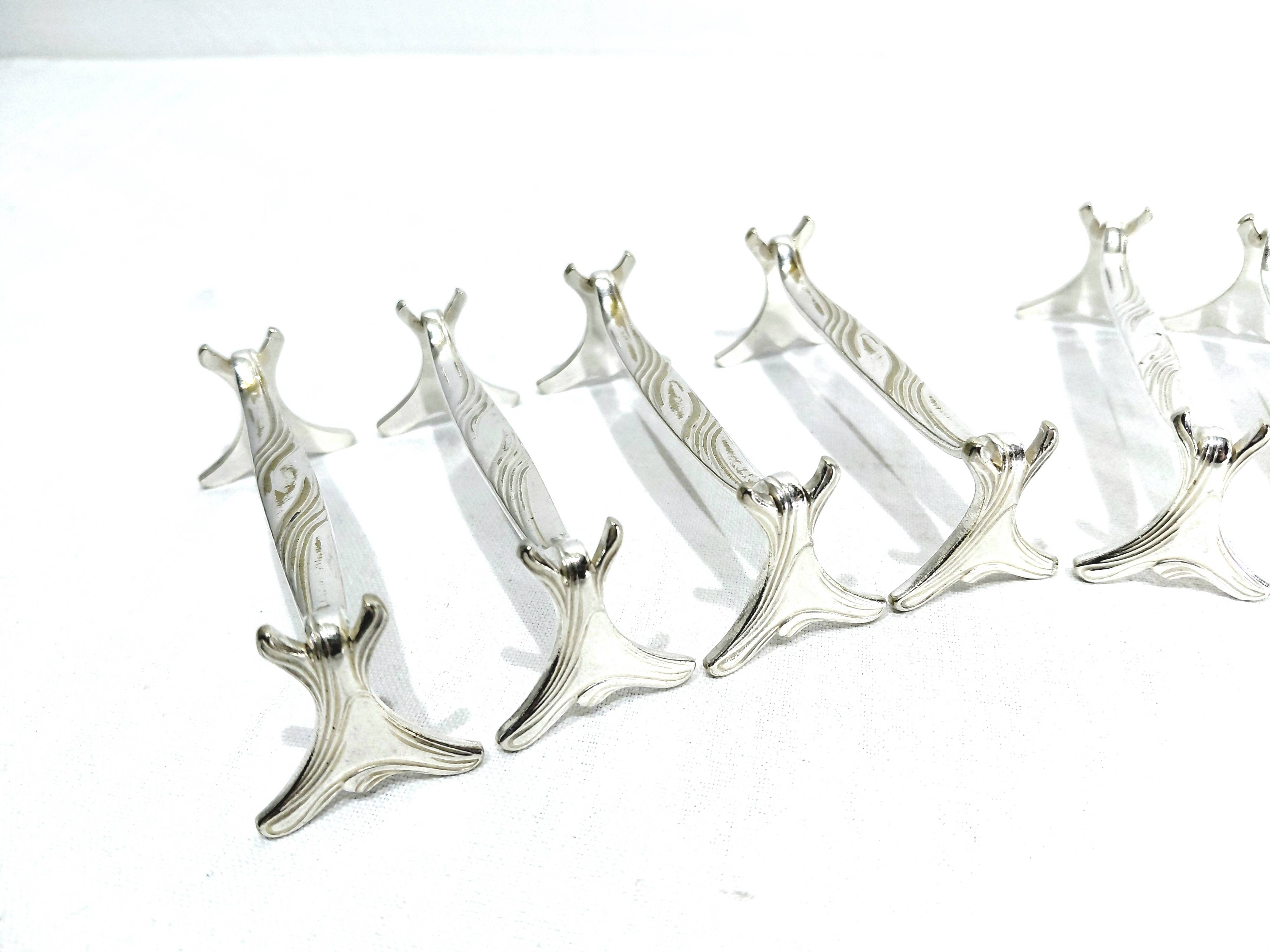 CHRISTOFLE - SET OF 11 SILVER-PLATED KNIFE RESTS
