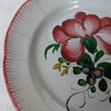 Old earthenware plate of the East Strasbourg decorated with flowers