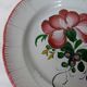 Old earthenware plate of the East Strasbourg decorated with flowers