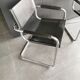 Metal and black leather design armchair pair