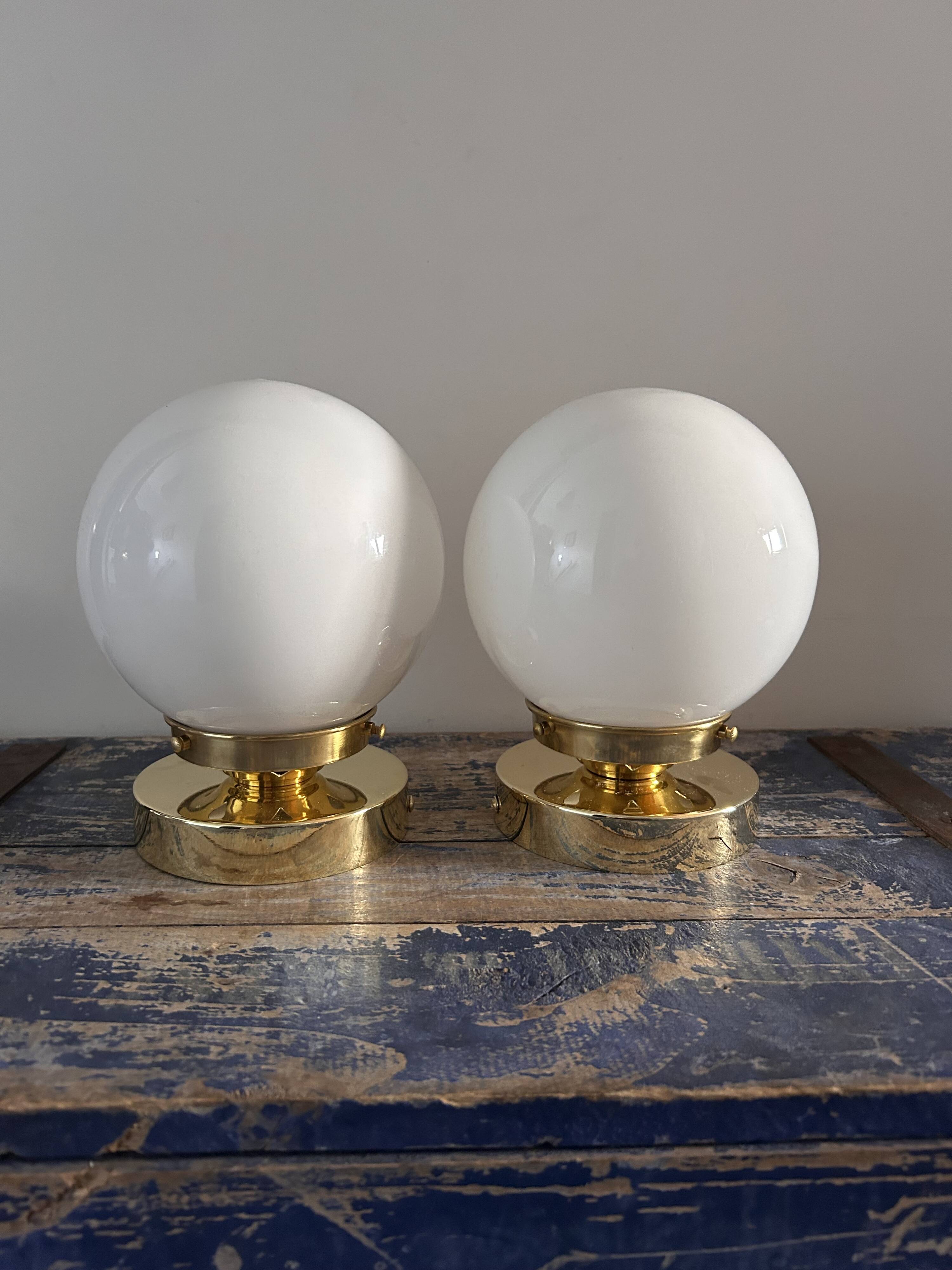 Set of white opaline globe sconces