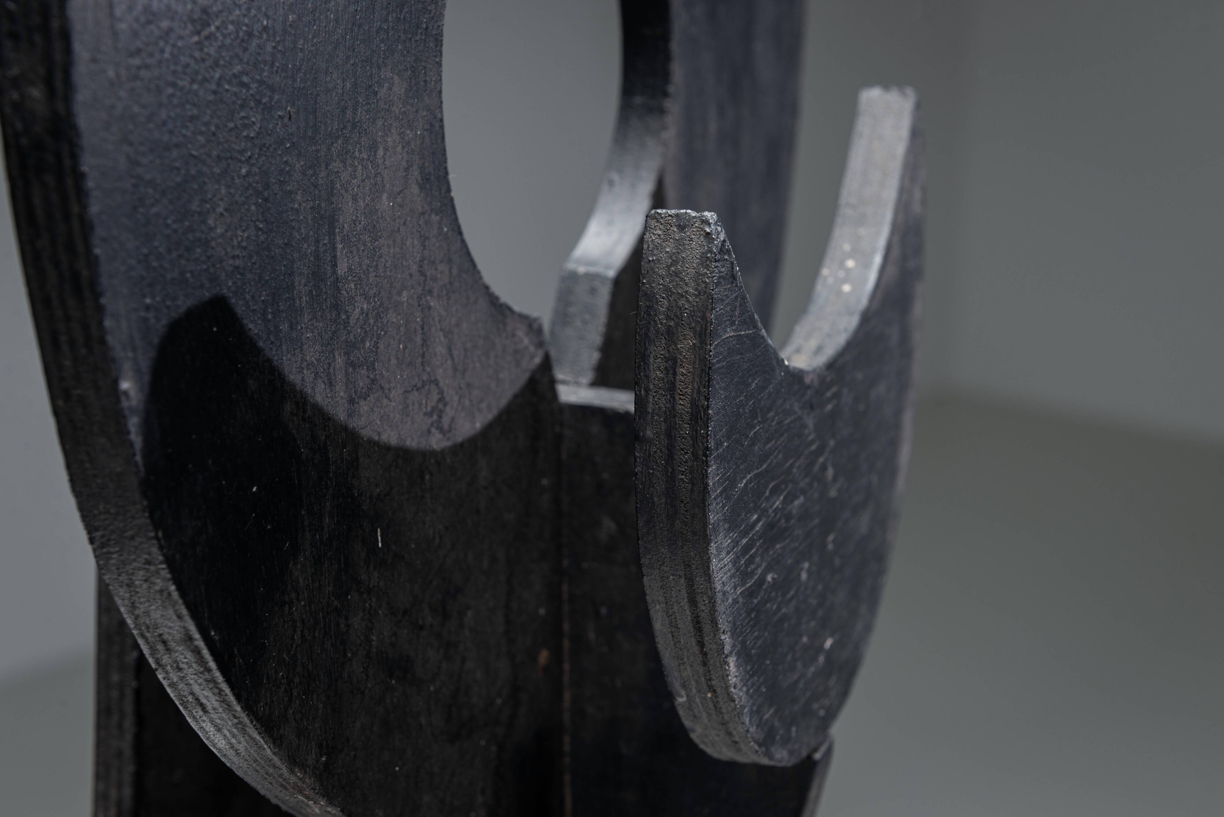 Abstract multilayered wooden sculpture with geometric shapes