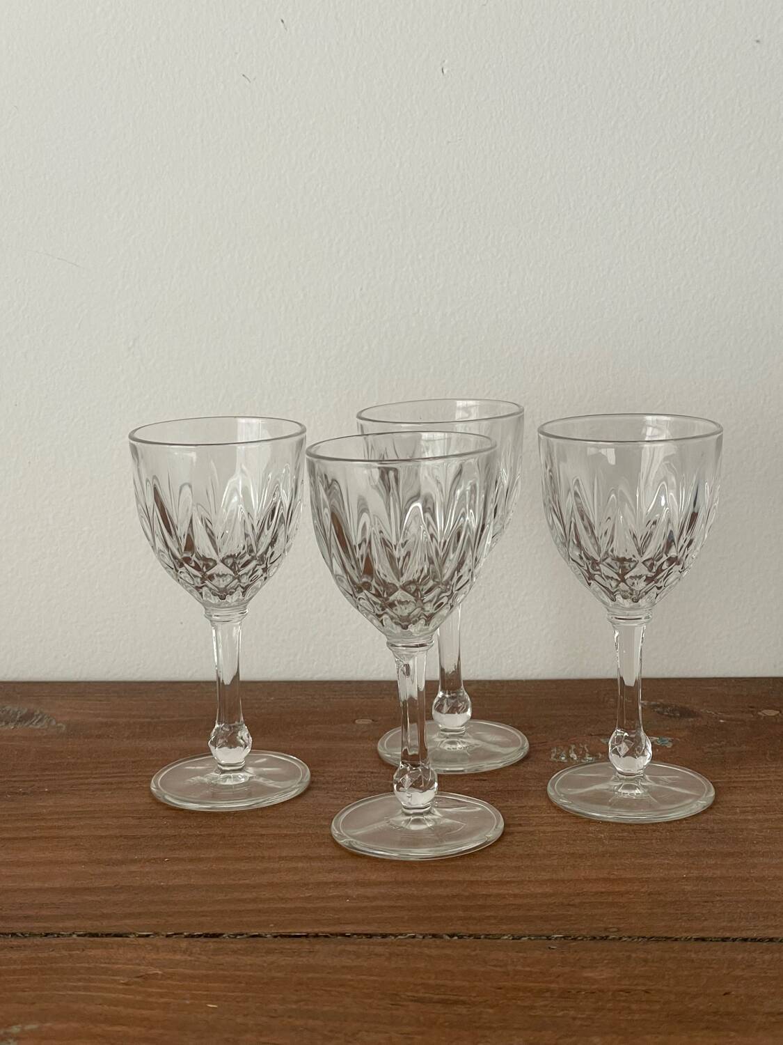 4 cut glass liqueur glasses on stems