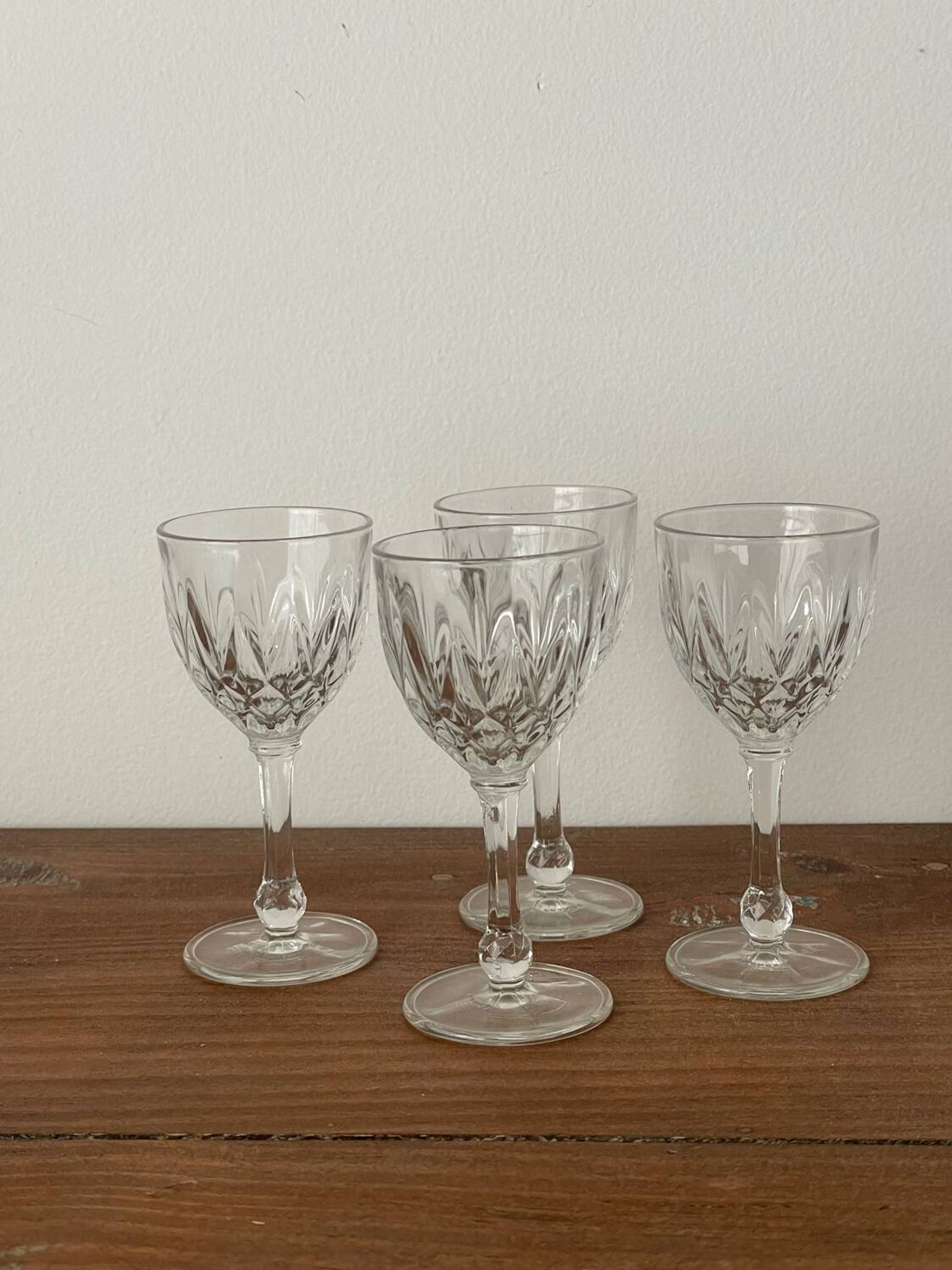 4 cut glass liqueur glasses on stems