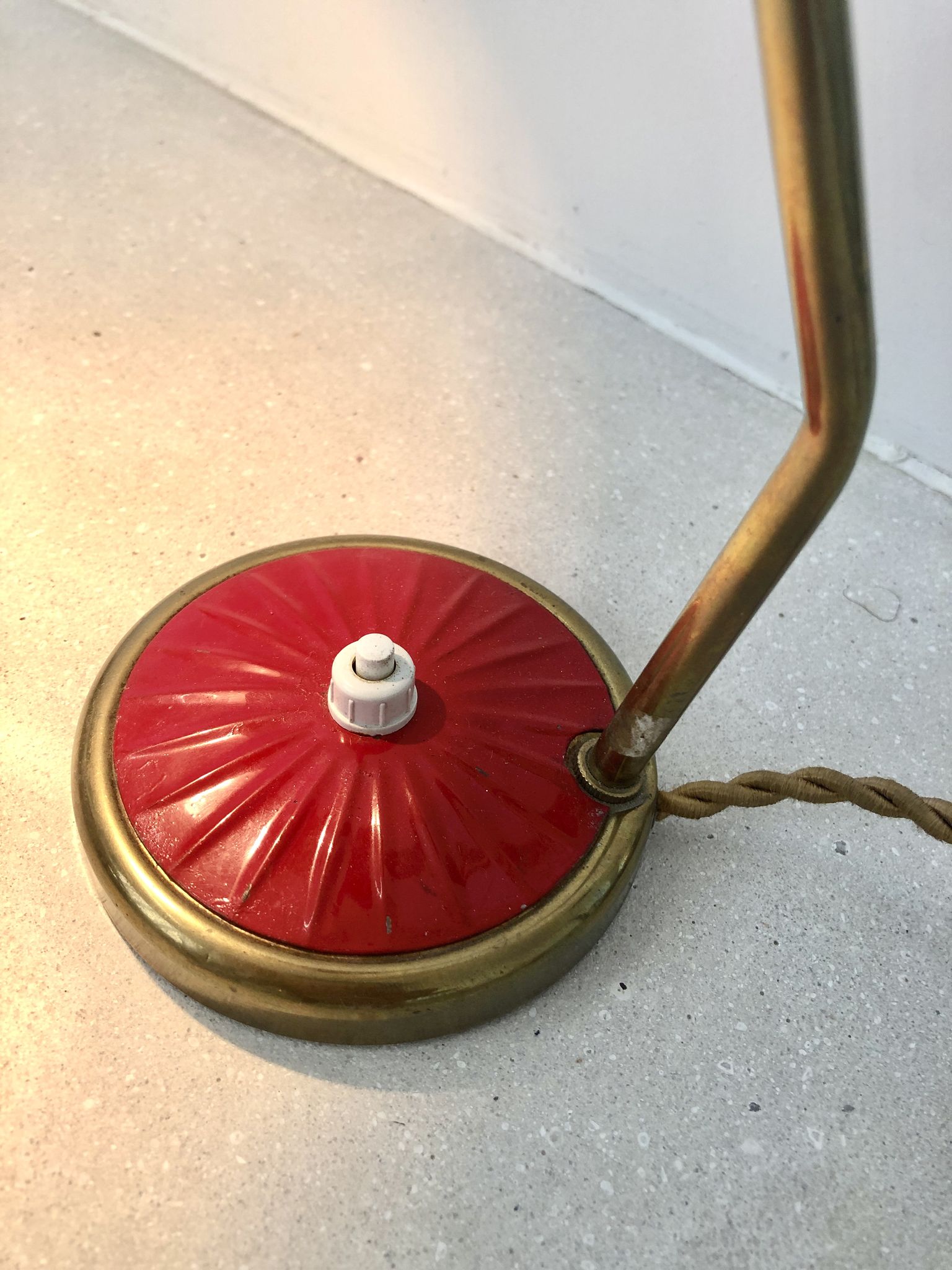 Brass desk lamp with articulated red diabolo lampshade