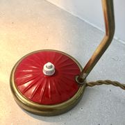 Brass desk lamp with articulated red diabolo lampshade