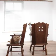 Pair of brutalist oak lounge chairs with rush seats, circa 1935