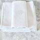12 antique French linen towels with damask embroidery with "GB" anagrams.