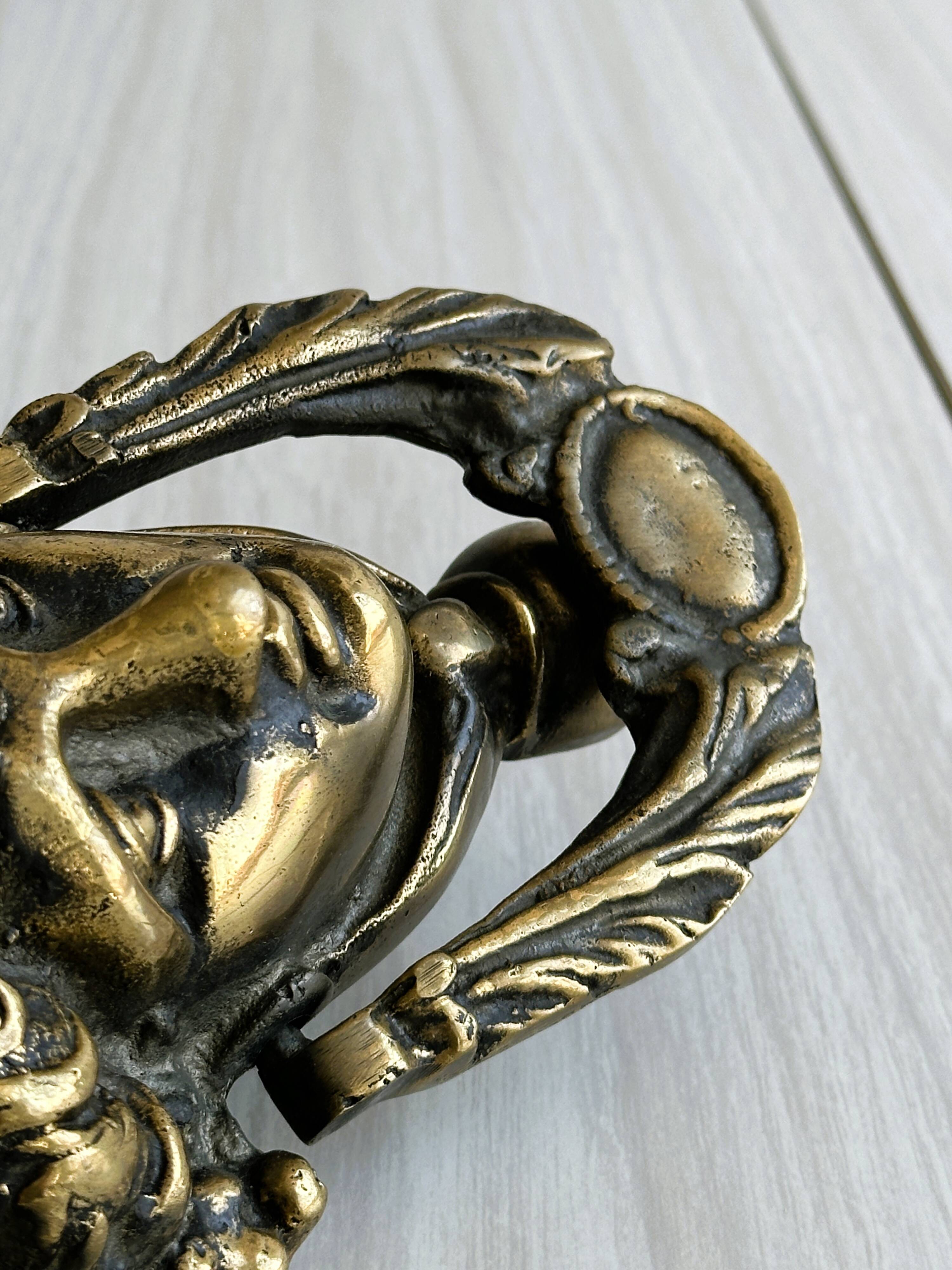 Large antique style brass metal knocker.