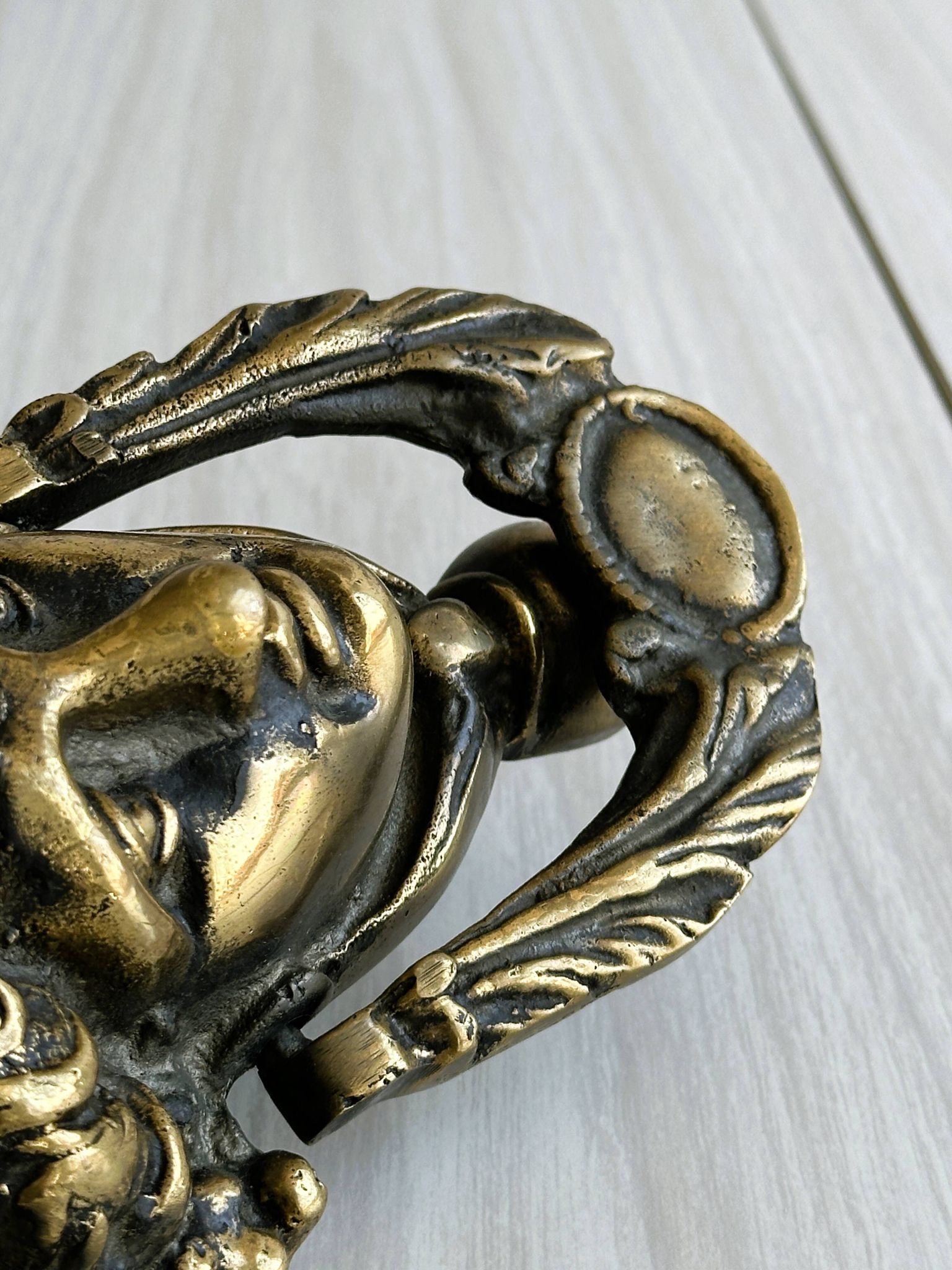 Large antique style brass metal knocker.