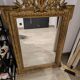 Antique mirror in Napoléon III style with a laurel pediment.