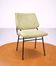 Vintage 1950s chair in black metal and almond green fabric.