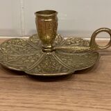 Brass candle holder on frame