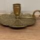 Brass candle holder on frame
