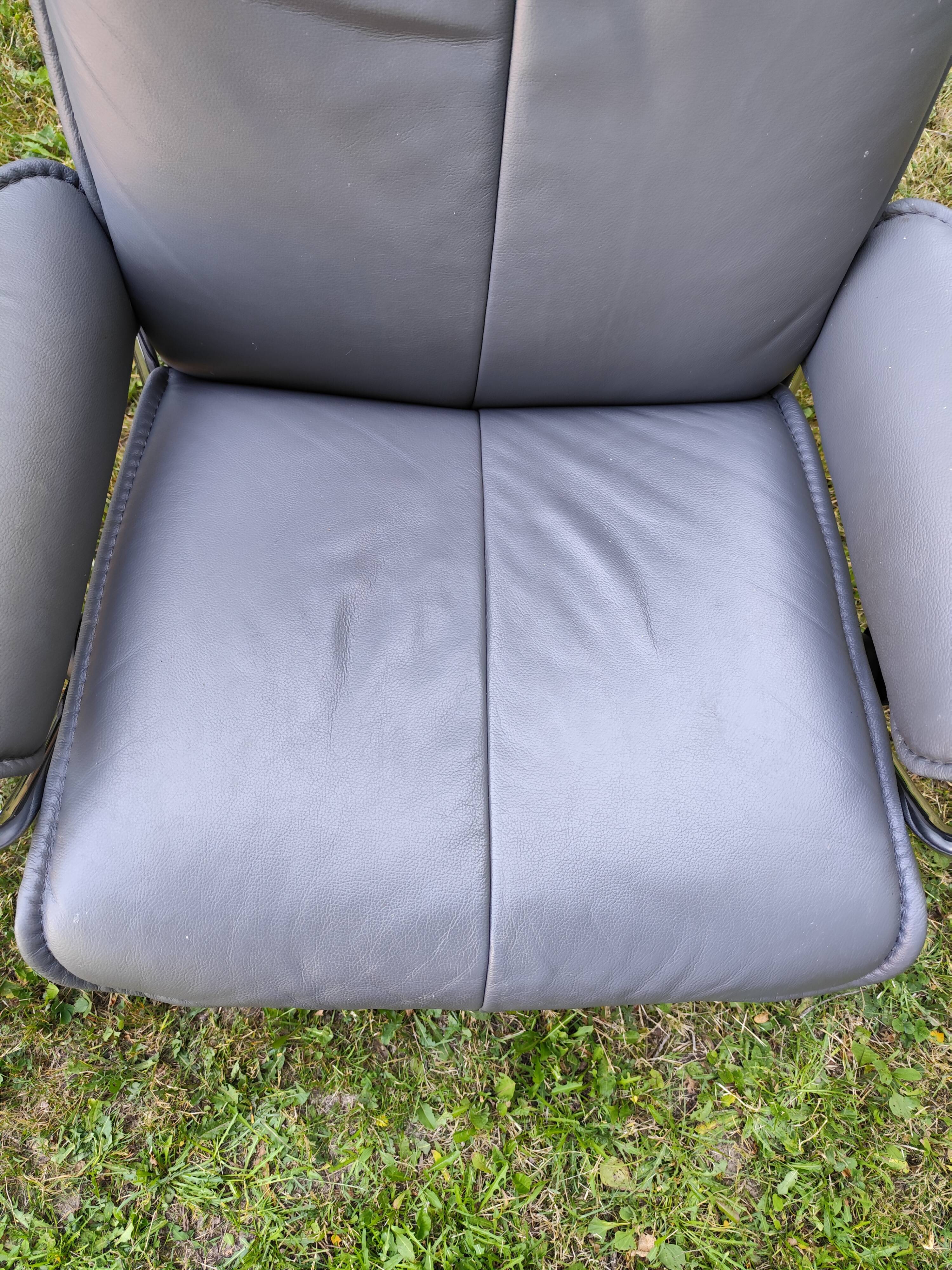 Stressless City armchair with footrest/ottoman, grey