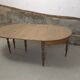 Half-moon extendable oak table for 2 to 8 people.