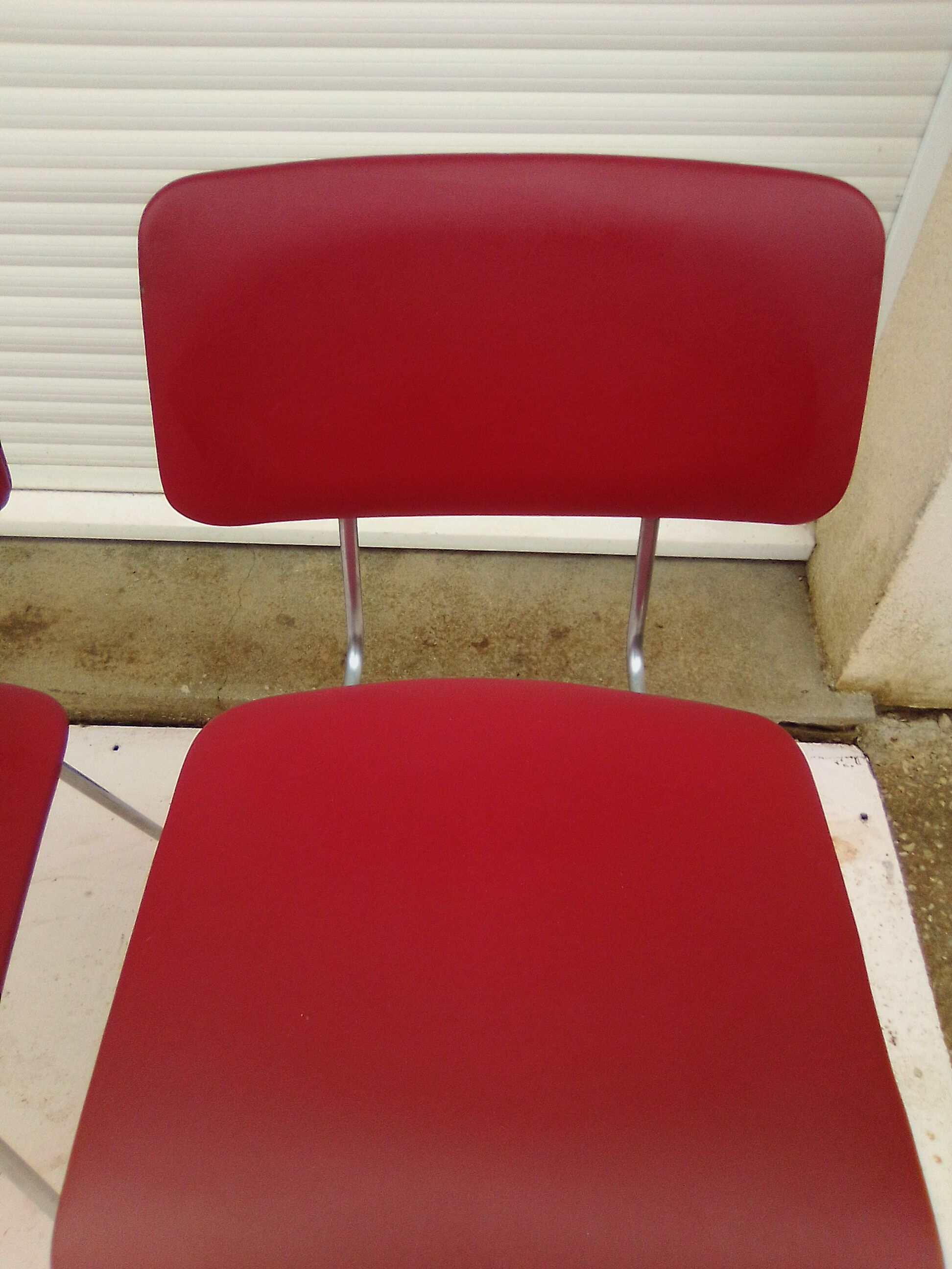 2 chairs in red skaï metal struxture 70s