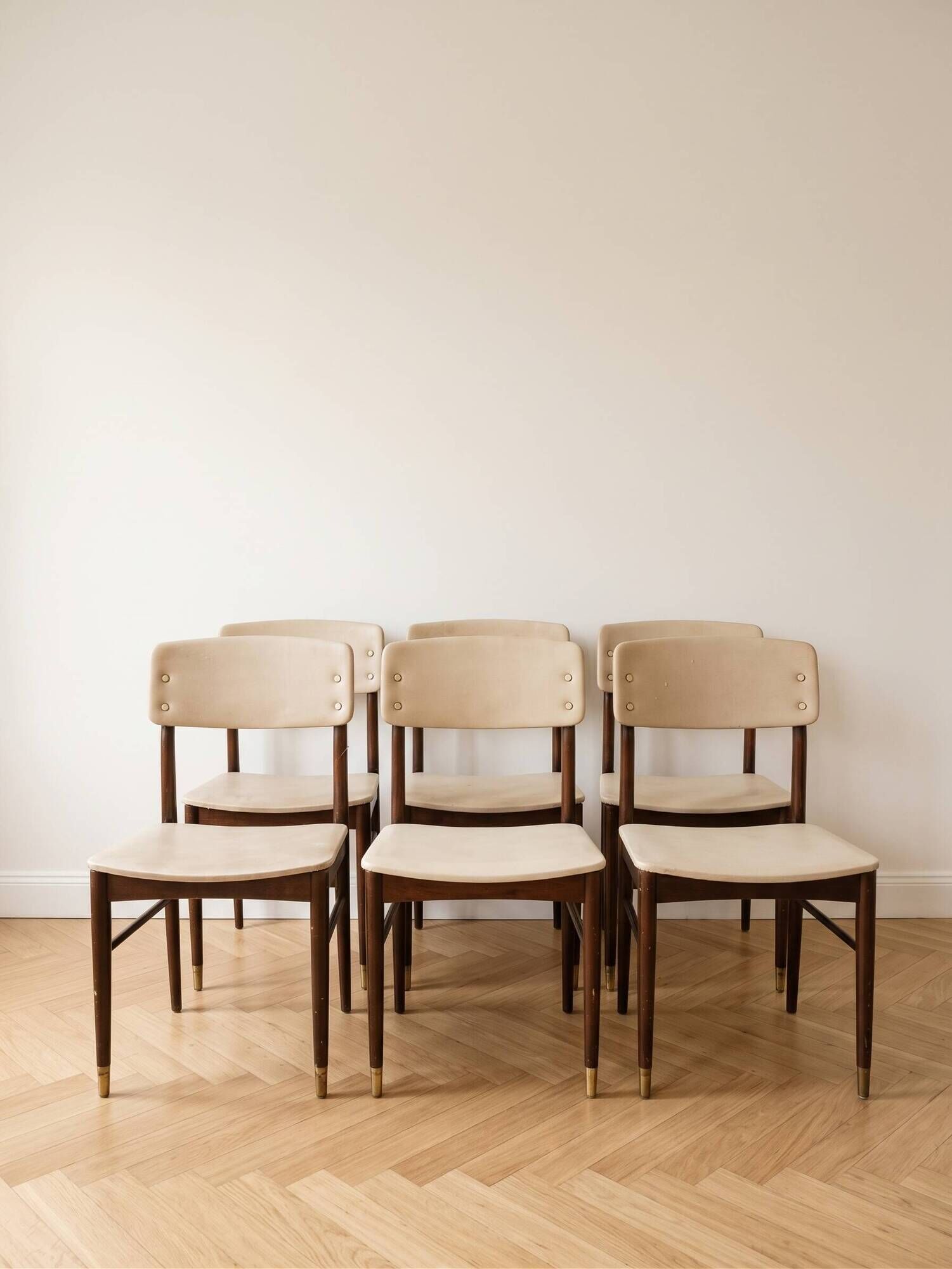 Set of 6 vintage 1950s chairs in wood and faux leather.
