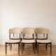 Set of 6 vintage 1950s chairs in wood and faux leather.