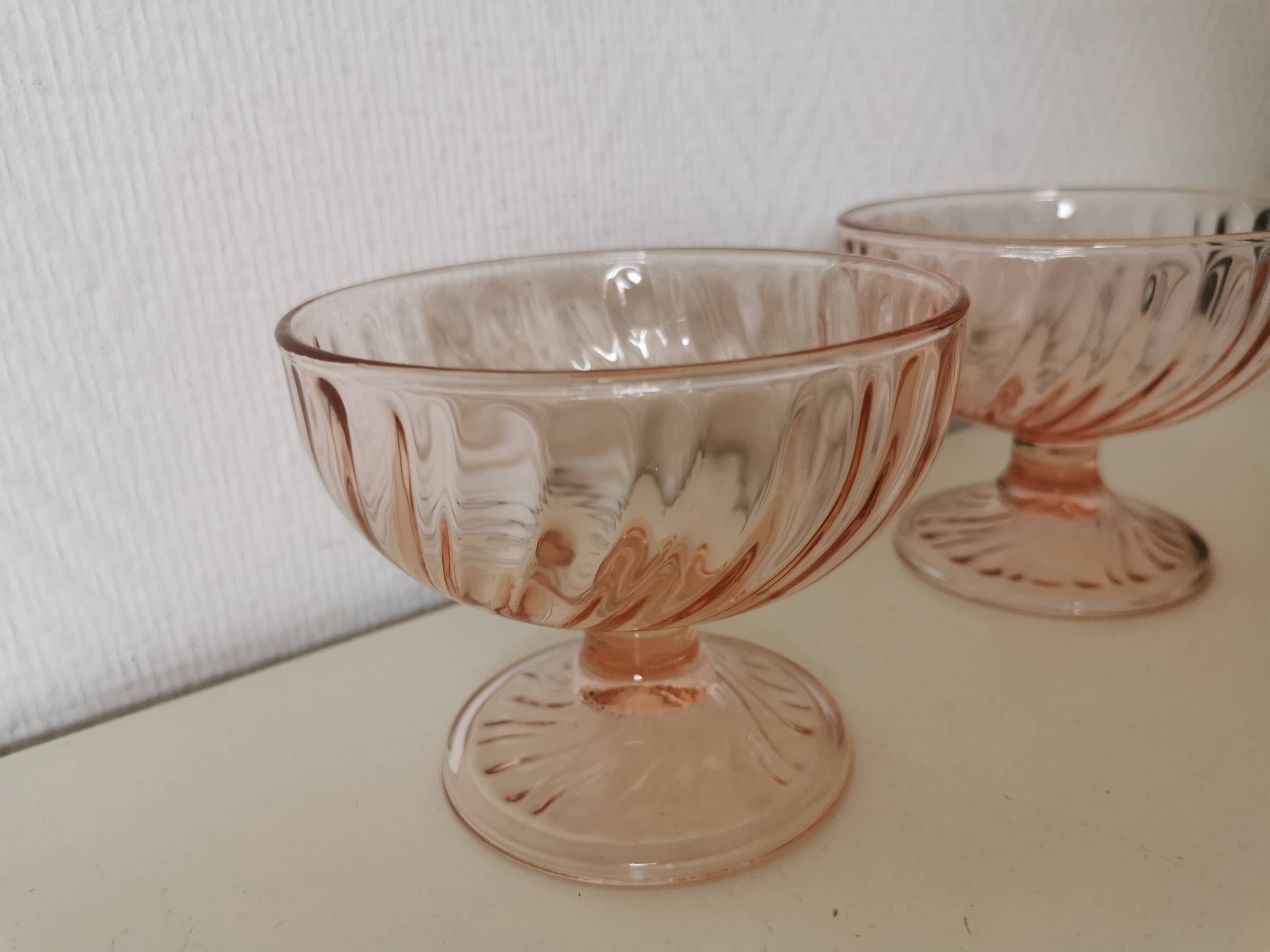 Pair of pink rosaline swirl glass fruit bowls