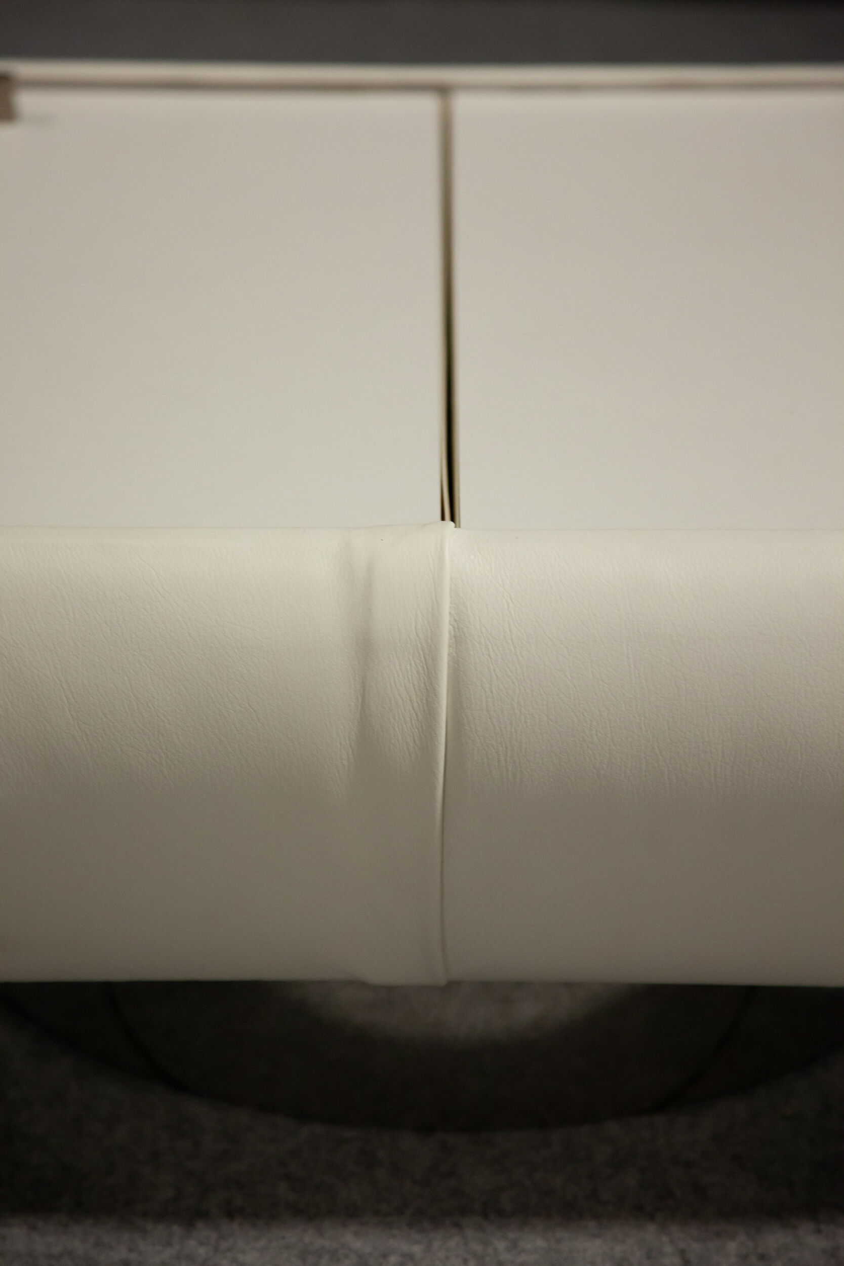 Pair of 70s white leather bedsides
