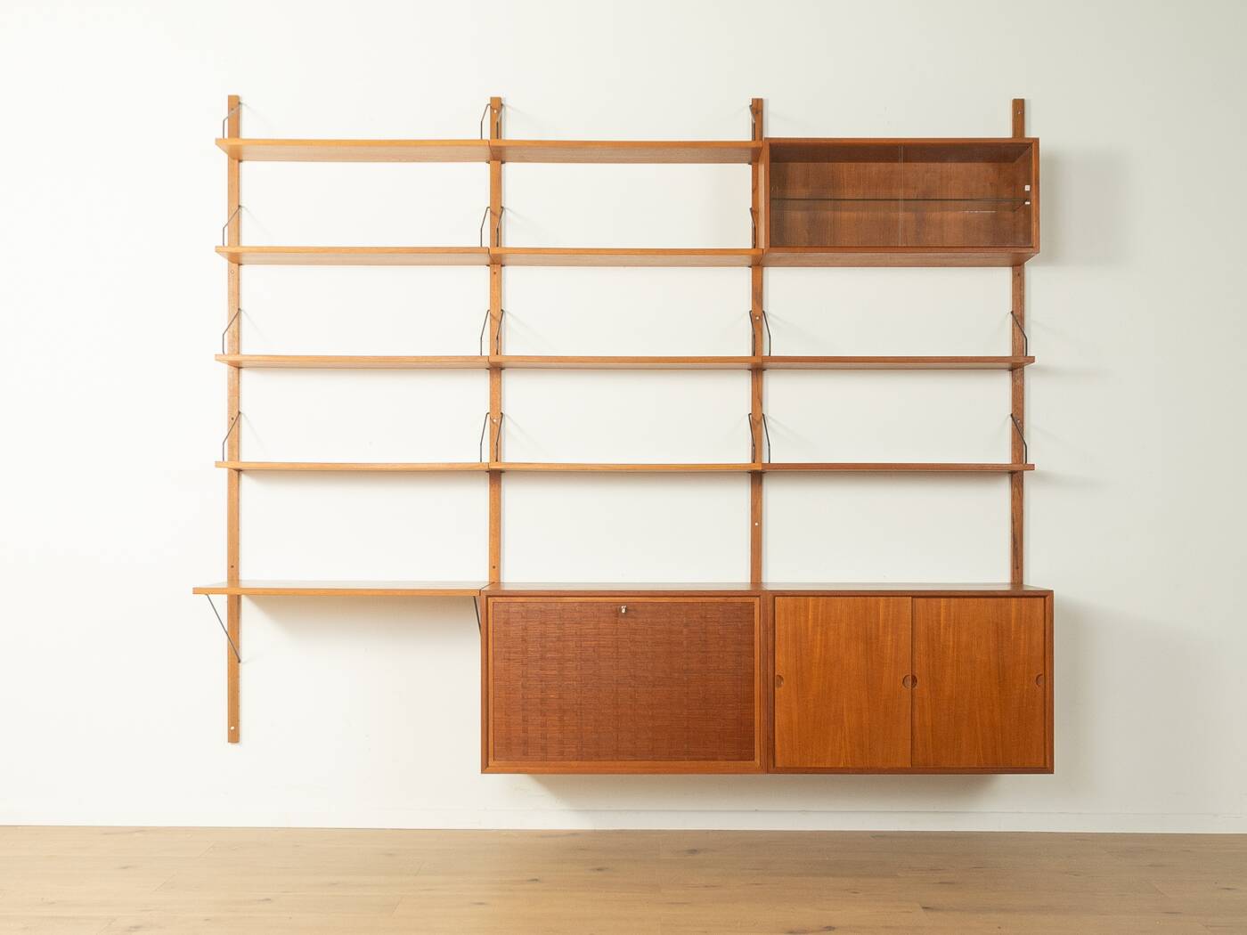Classic shelving system from the 1950s in teak veneer by Poul Cadovius for Cado