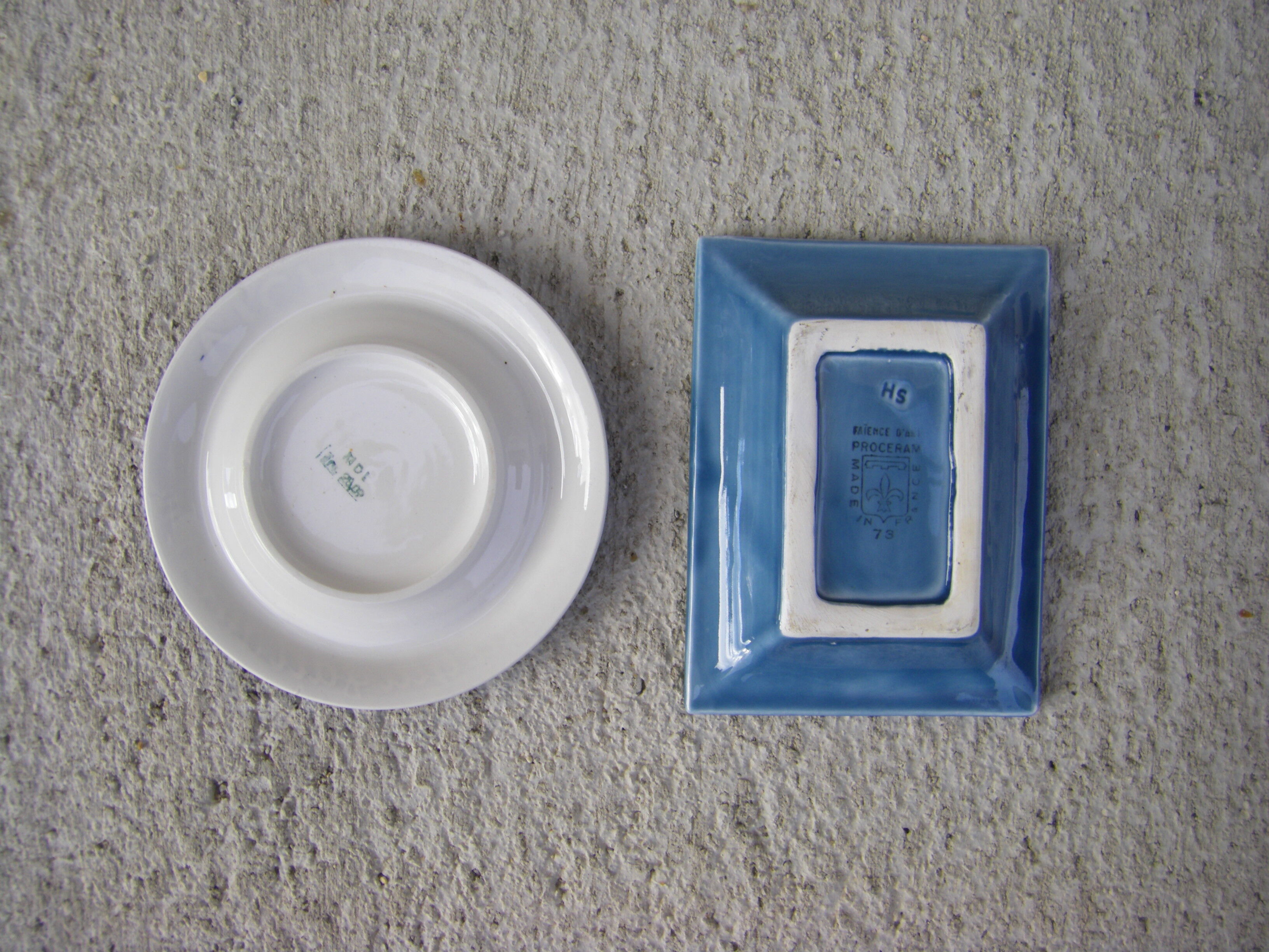 Two advertising ashtrays