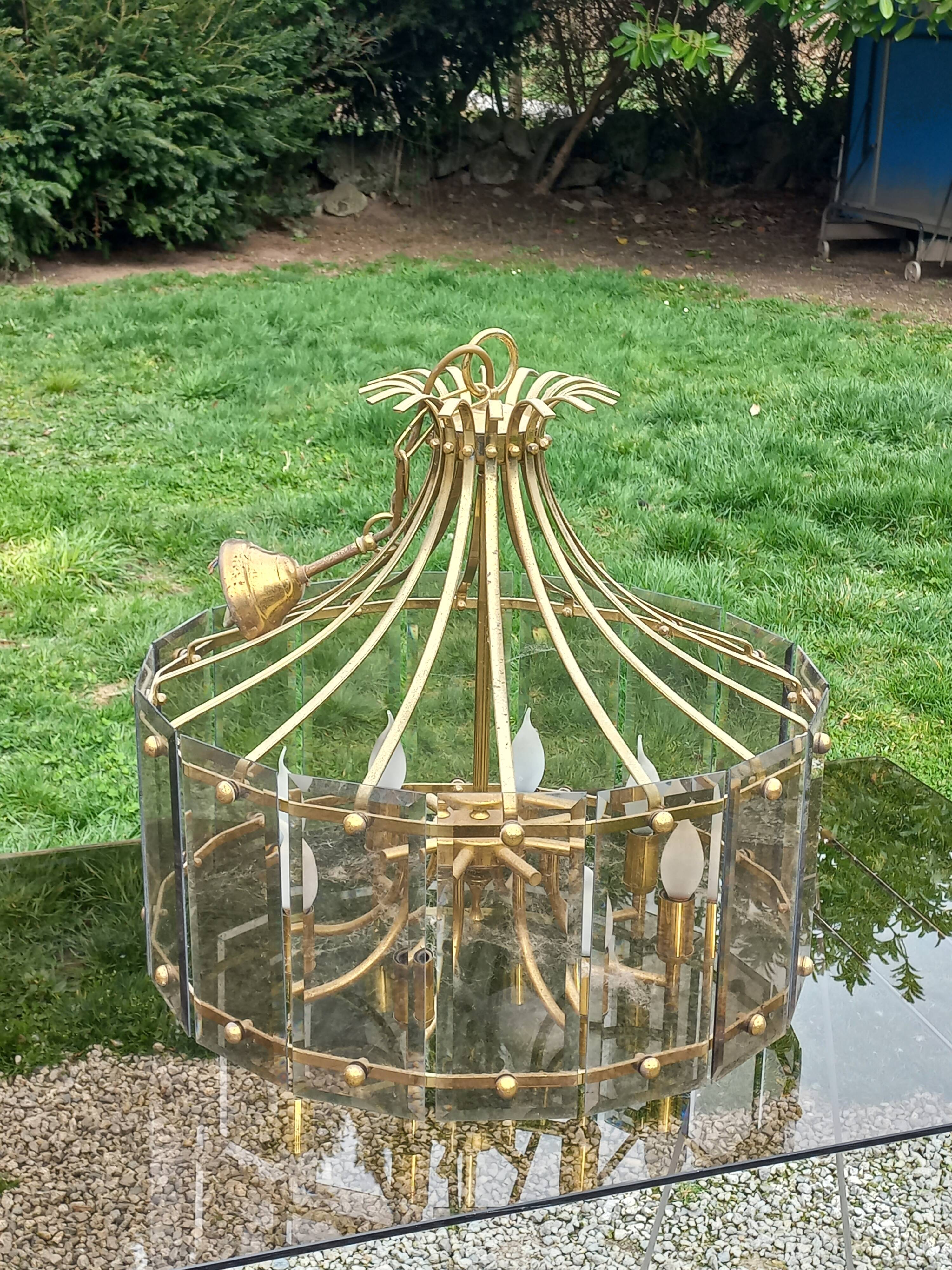 70s designer chandelier with smoked glass plates and gold metal frame