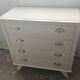 Vintage commode in solid pear wood, revamped in glossy white – tapered legs.