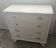 Vintage commode in solid pear wood, revamped in glossy white – tapered legs.
