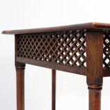 Hexagonal pedestal table or side table with a lattice structure and star pattern.