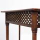 Hexagonal pedestal table or side table with a lattice structure and star pattern.