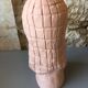 Bust of lady with hood in terracotta