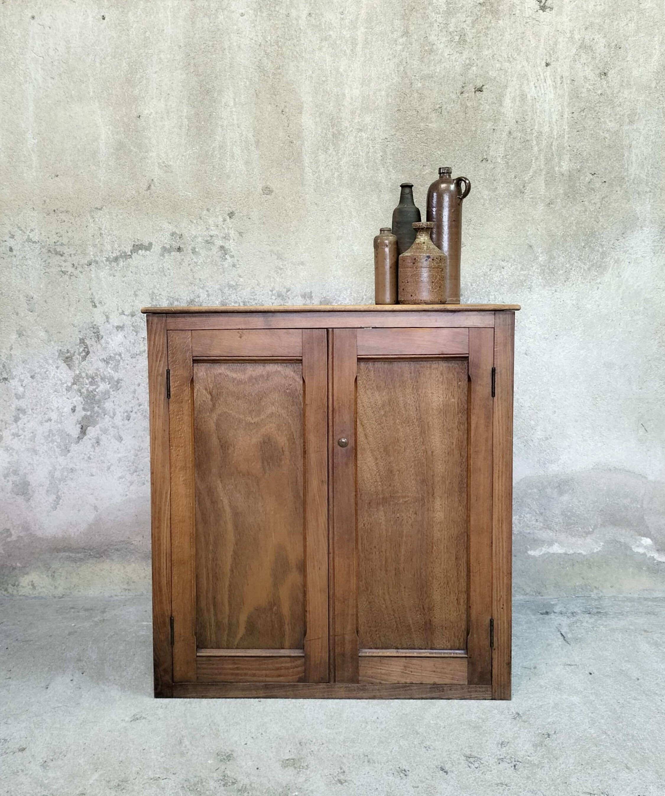 Small wooden sideboard with two doors.