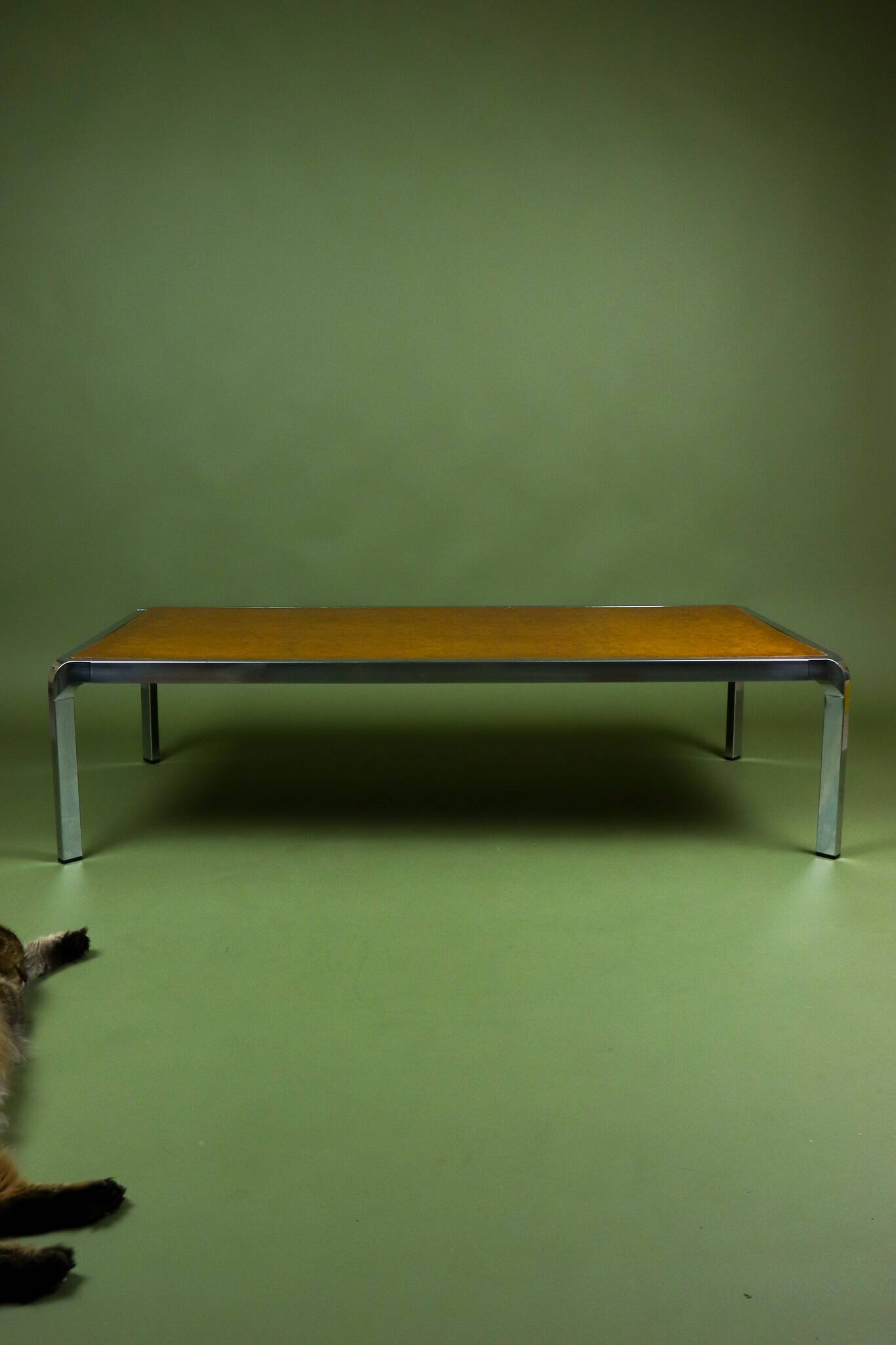 Vintage 1970s coffee table in chrome and burl wood.