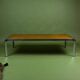 Vintage 1970s coffee table in chrome and burl wood.
