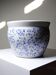 Vintage Chinese cache-pot in blue and white porcelain with a floral design.