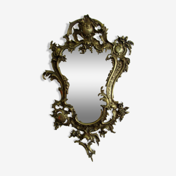 Miroir de style Louis XV, à cadre bronze.